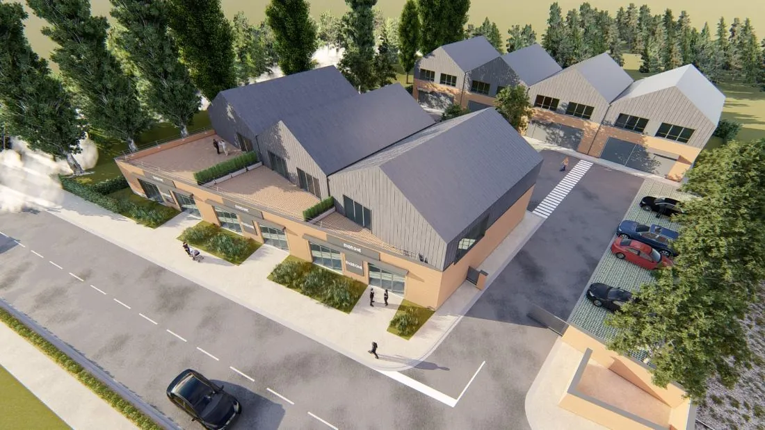 Vue aérienne du programme : bâtiment A côté rue avec terrasses, bâtiment B en fond, parkings arborés